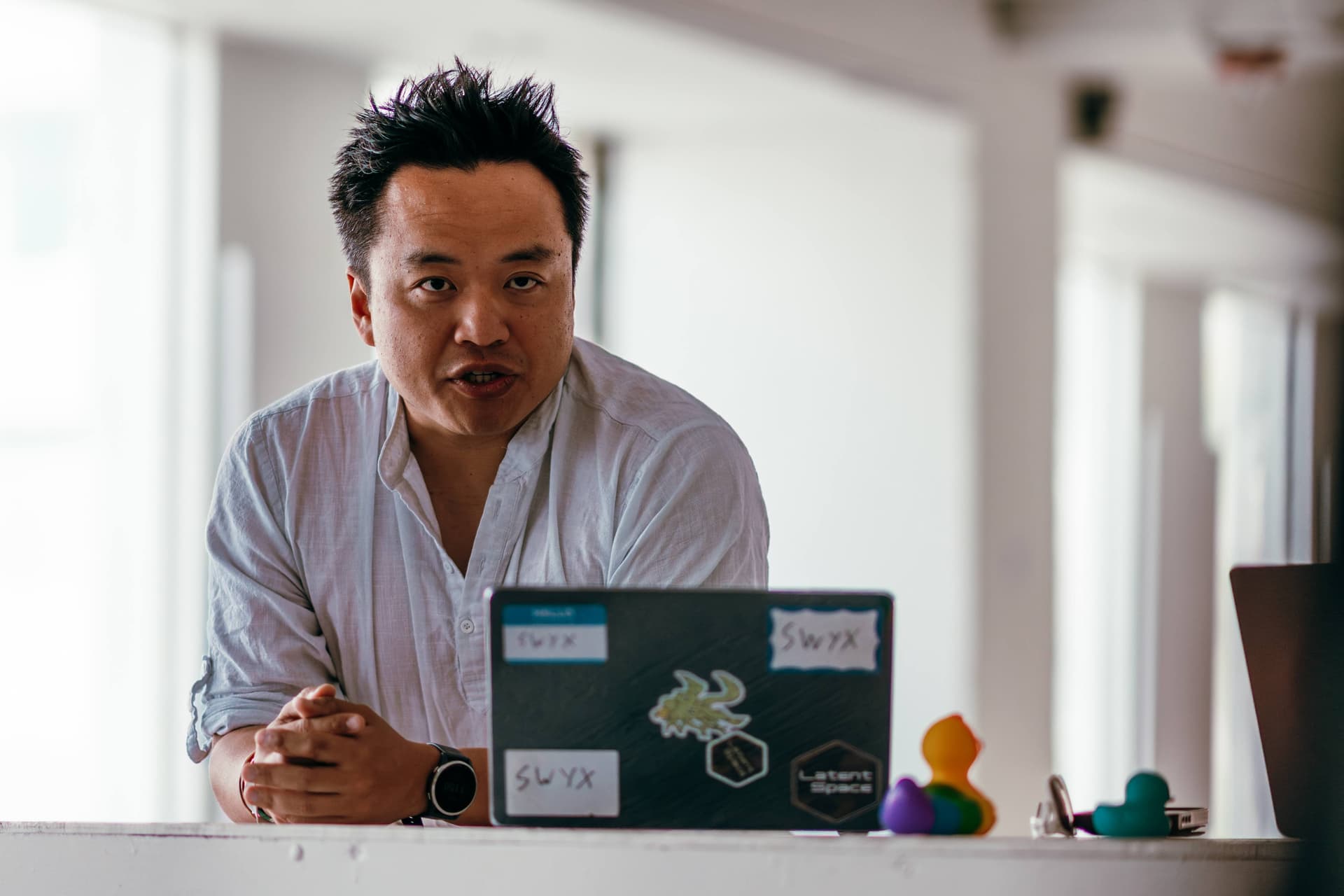 A man sitting in front of a laptop computer