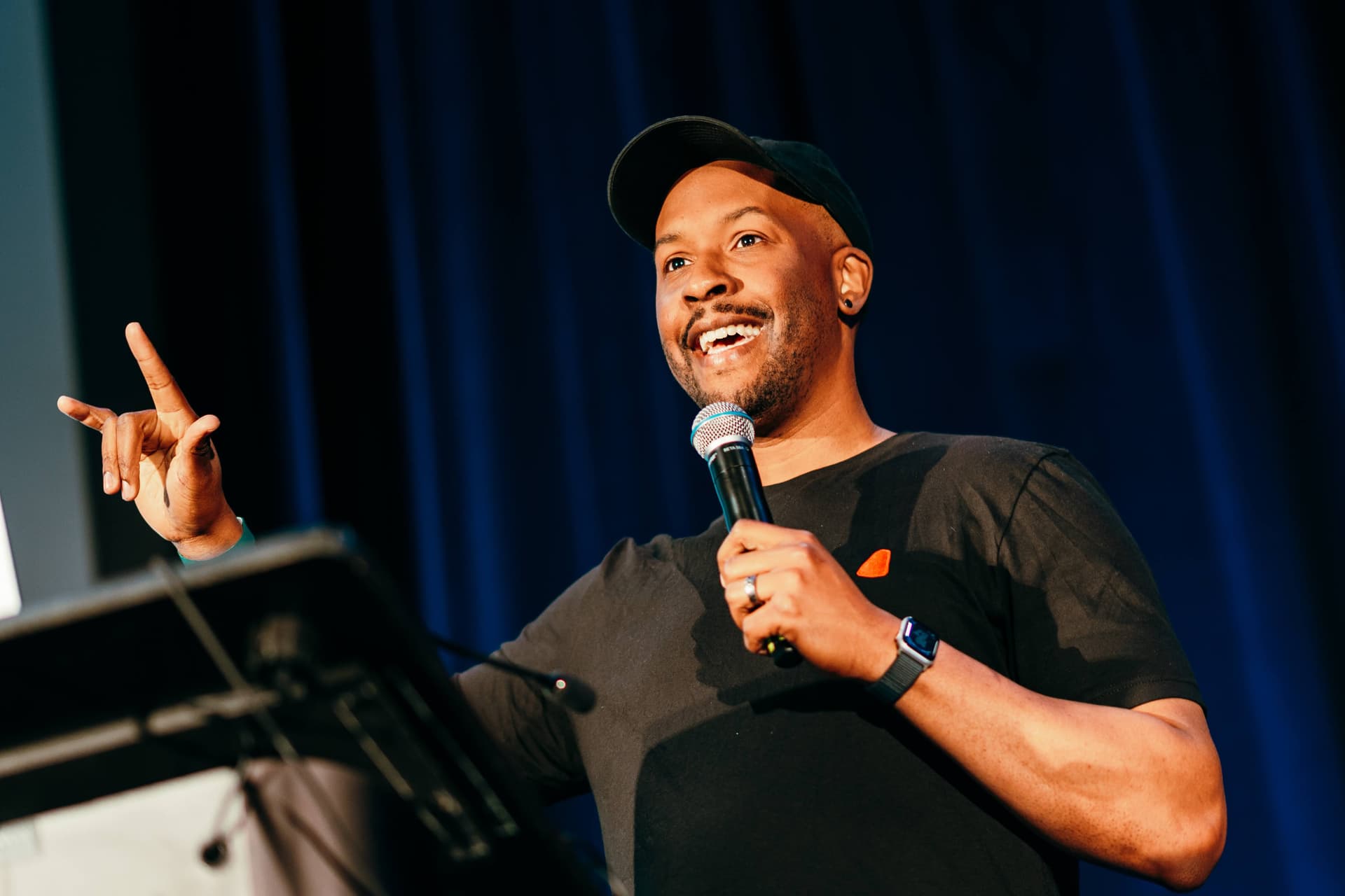 A man giving a speech with a microphone