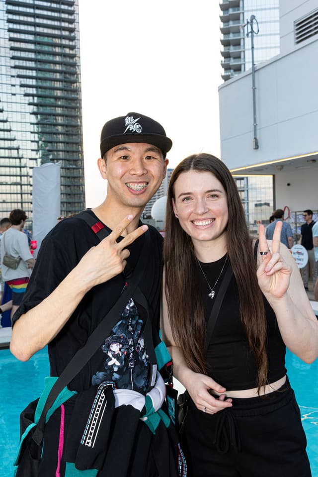 A man and woman smiling at the camera.